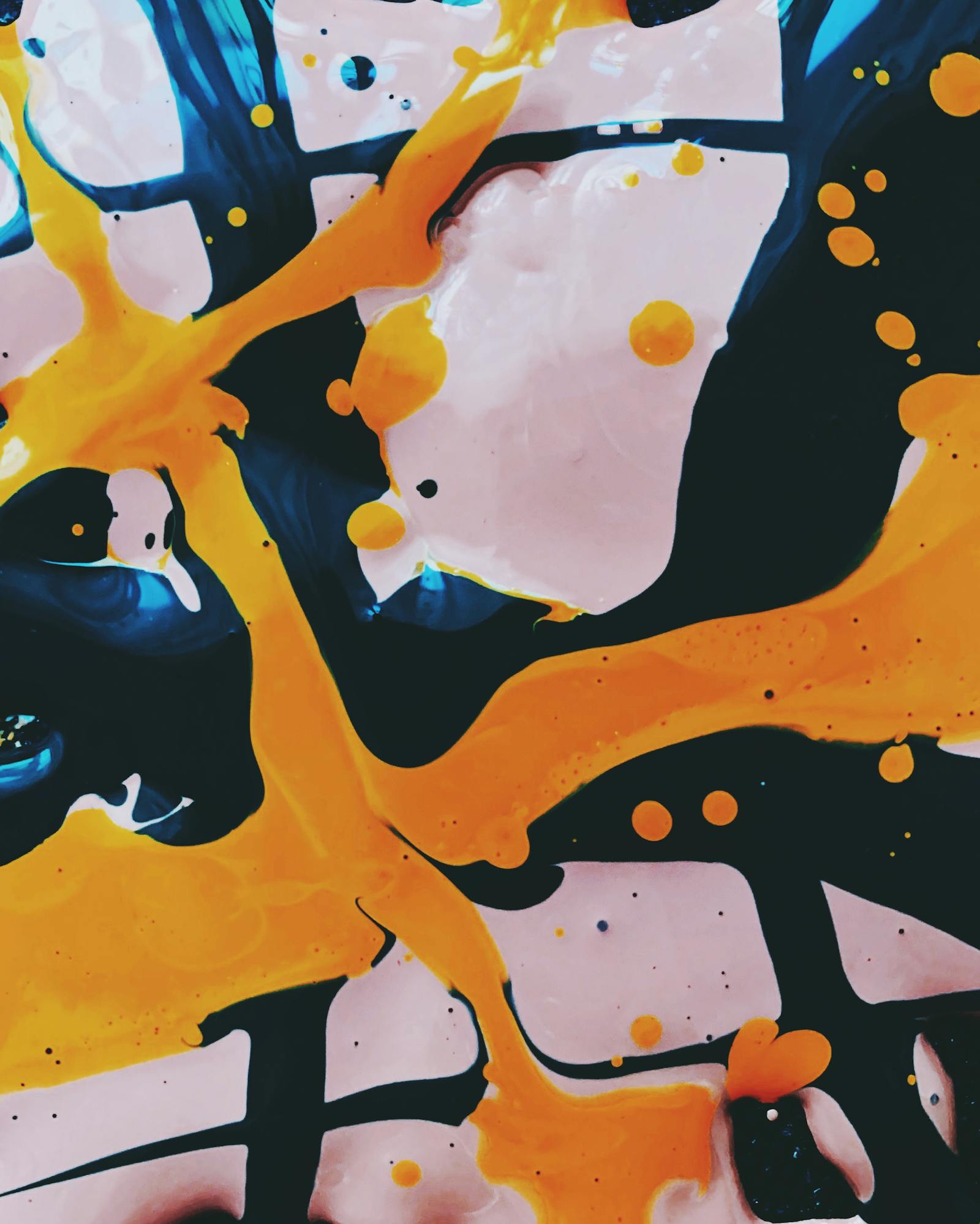 Colorful paint drops on a bright surface